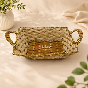 Woven basket with handles on a light background, featuring the brand 'Bakery'.