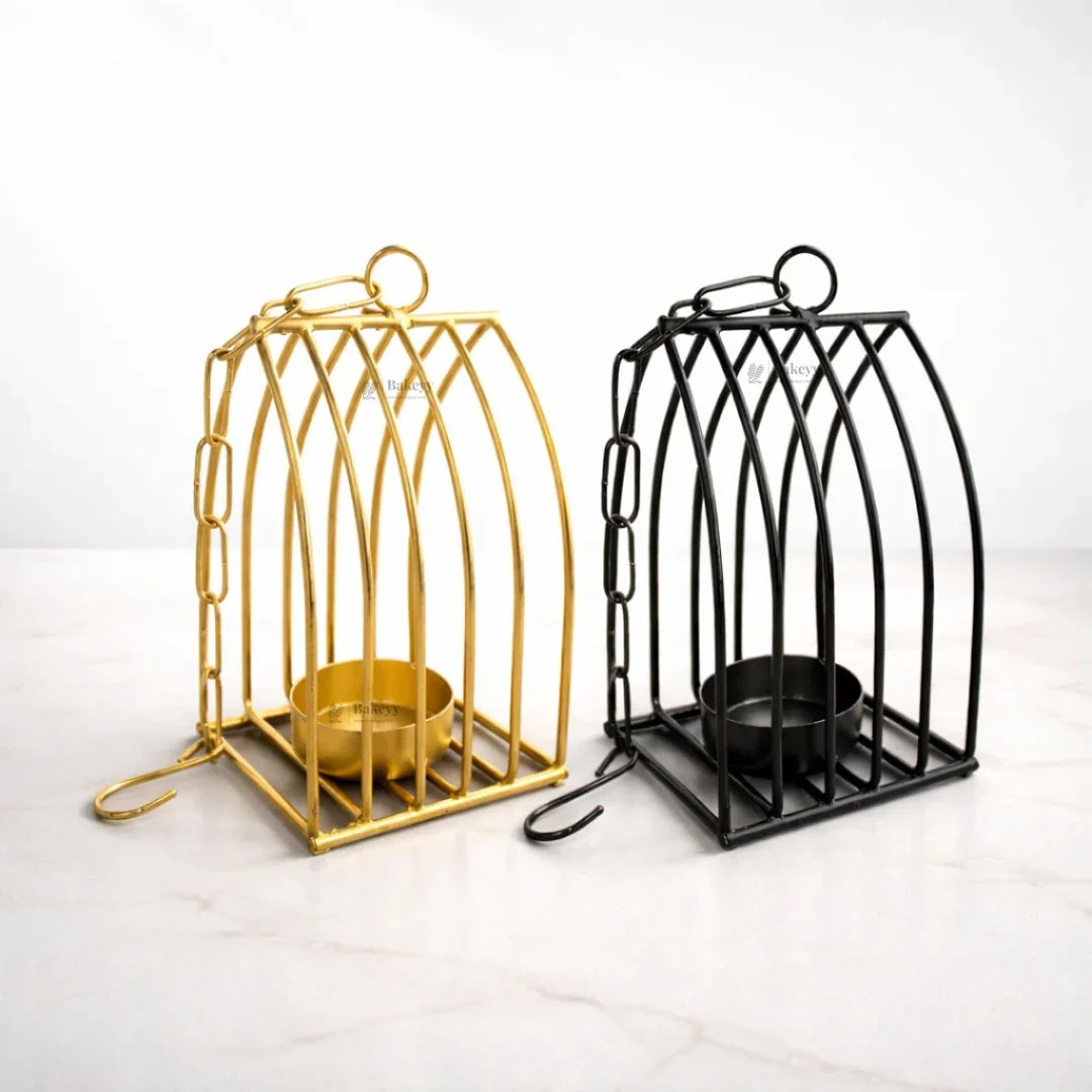 Gold and black metal diya stands for home decor or festive display on marble surface