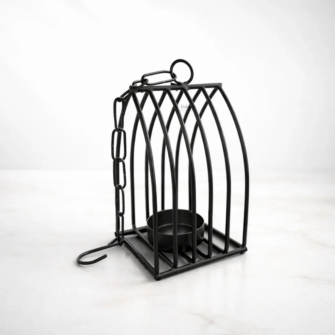 Black metal diya stand with chain, modern gift decor on white background for Bakeyy.com