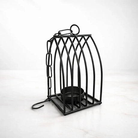 Black metal diya stand with chain, modern gift decor on white background for Bakeyy.com