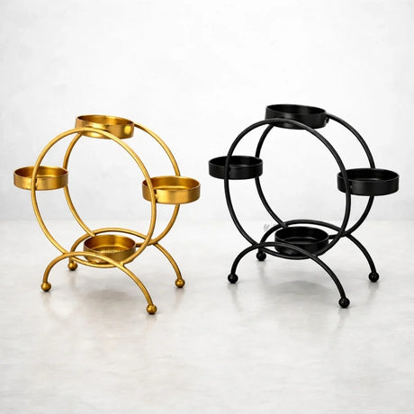 Gold and black metal diya stands with four holders for festive decor, Bakeyy.com product image