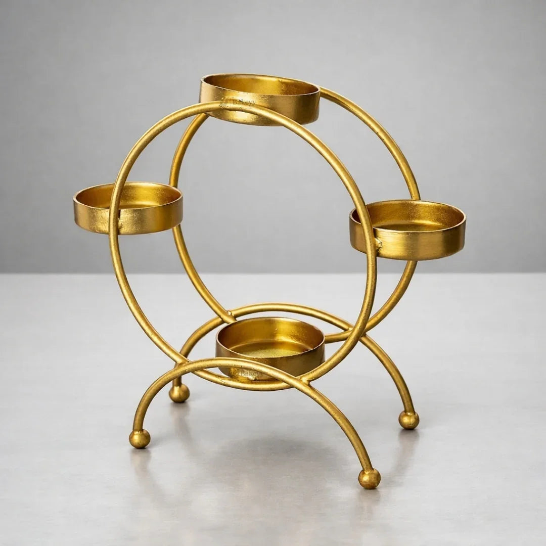 Gold metal diya stand with four round holders for decorative display, Bakeyy wholesale decor
