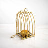 Gold metal diya stand with geometric design, decorative home decor from Bakeyy.com