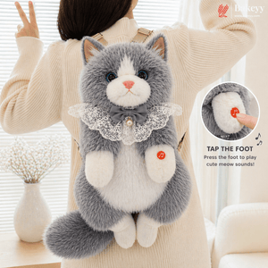 Gray and white cat-shaped plush toy with a person wearing it, featuring a small inset showing a foot pressing a button.Cute Plush Cat Backpack | Meow Sound Interactive | Wearable Storage Soft Backpack Toy | Pack of 1