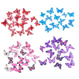 Colorful edible wafer butterfly cutouts in red, blue, pink, and purple for cake decorating