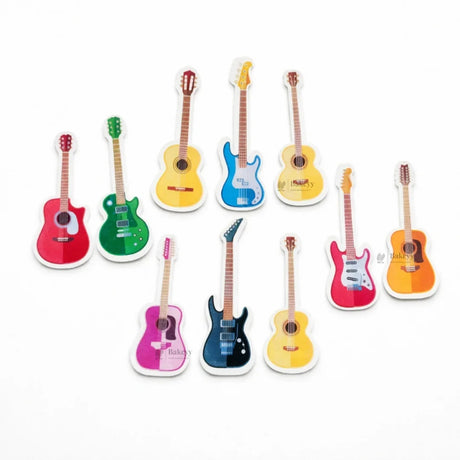 Colorful guitar-shaped precut edible wafer toppers from Bakeyy for cake decorating