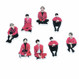 Precut edible wafer toppers of seven men in red outfits, perfect for cakes from Bakeyy.com